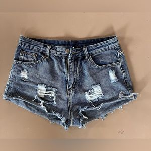 Mid wash ripped Daisy Duke jean shorts
